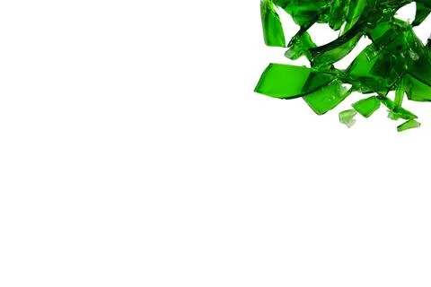 Sharp and jagged pieces of broken green glass cut out on a white background.. Stock Photos