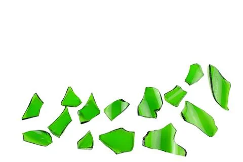 Sharp and jagged pieces of broken green glass cut out on a white background.. Stock Photos