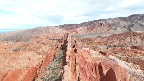 Sharp and vibrant colourful geological formation in Skazka Canyon, Kyrgyzstan Stockbeeldmateriaal 339125217