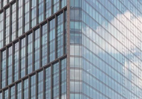 Sharp angles and rhythmic grids define this modern facade. The buildings br.. Foto stock