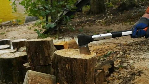 Sharp ax in the hands of a woodcutter Stock Footage 253471529