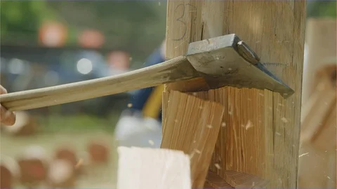 Sharp axe chopping wood log, country fair agricultural show Stock Footage 106600583
