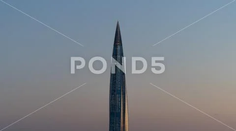 Sharp bayonet business skyscraper at sunset Stock Photos