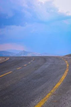 Sharp bend asphalt road in the mountain Stock Photos