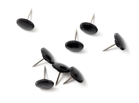 Sharp black button rivets on white background 库存照片