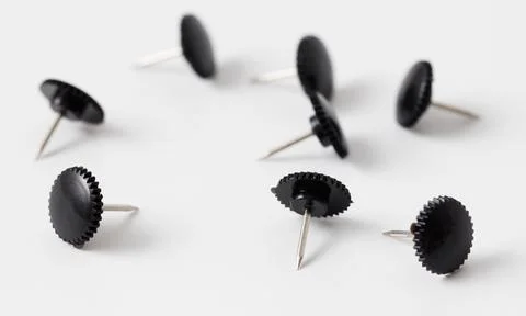 Sharp black button rivets on white background Stock Photos