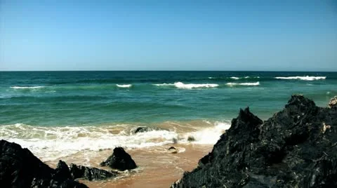 Sharp Black Rocks On Wild Beach At Sunny Day Pan Shot  Stock Footage 11589350