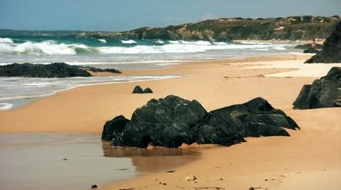 Sharp Black Rocks On Wild Beach At Sunny Day   Stock Footage 11590304