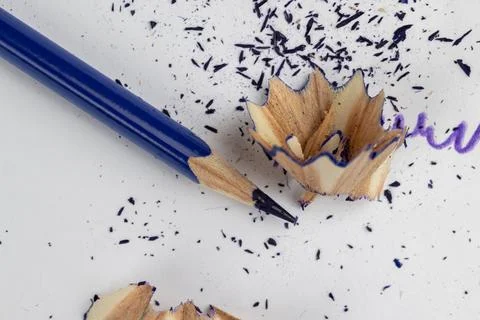 Sharp blue pencil on paper close-up 库存照片