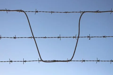 Sharp Boundaries: Spiked Metal Wire Stock Photos