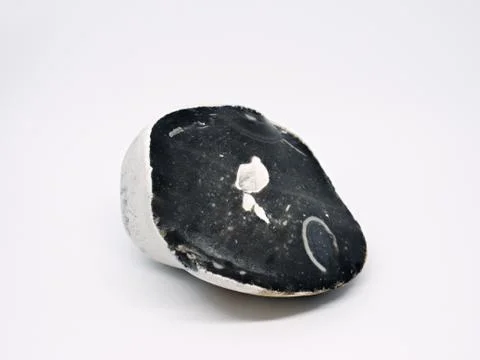 Sharp broken basalt stone with some cavity inside, isolated Stock Photos