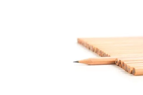 Sharp brown pencil stand out of the other brown pencils Stock Photos