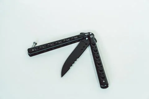 Sharp butterfly knife in various positions on a white background 写真素材