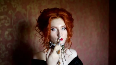 Sharp claws. Dark halloween attire. Sorceress woman is vampire Stock Footage 116554492