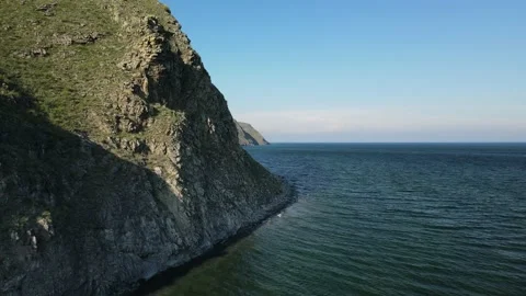 A sharp cliff and a rocky beach on Lake Baikal, Siberian Mountains. Stock Footage 170325088