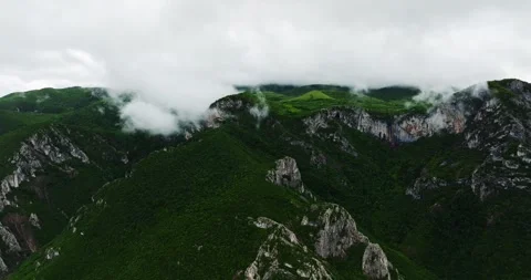 Sharp Cliffs Mountain Top Touching The Clouds Vibrant Aerial Landscape Stock-Footage 300442574