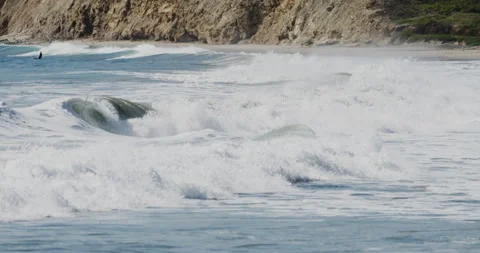 Sharp Close up of Slow Motion Footage of Waves Crashing on the Beach - Stock Stock Footage 239479545