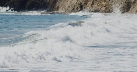 Sharp Close up of Slow Motion Footage of Waves Crashing on the Beach - Stock Stock Footage 239479854