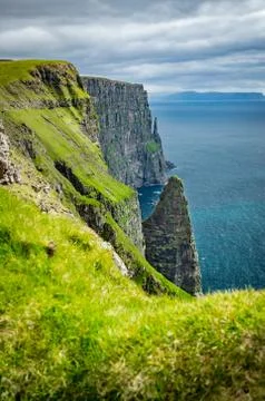 Sharp coastline, iconic rocks in Faroe Islands Stock Photos