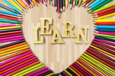 Sharp color pencils and Learn text Stock Photos