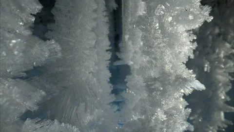 Sharp crystal icicles, ice snowflakes on stalactites inside frozen cave Stock Footage 274480515