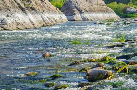 The sharp decline in the water level in the river due to the heat and activit Stock Photos