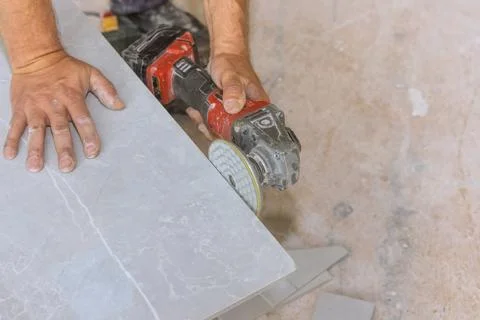 Sharp diamond blade on a powerful electric grinder with polishing corner to Stock Photos