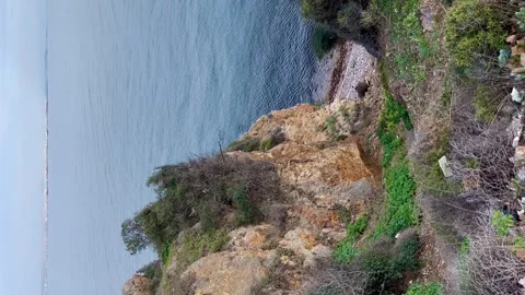 Sharp drop to the sea.- Vertical stock video Stock Footage 240326086