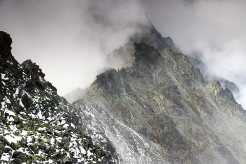 Sharp edge ridge in clouds, Slavkovsky peak, High Tatras Stock Photos