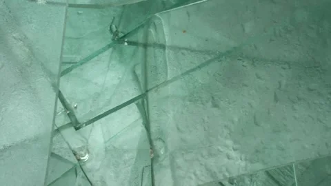 Sharp, frozen sheet glass waste in big white bags for recycle Stock Footage 321190466