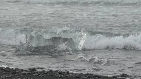 Sharp Glacial Ice Fragments Moving in Ocean Waves at Diamond Beach in Iceland Stock Footage 339953687