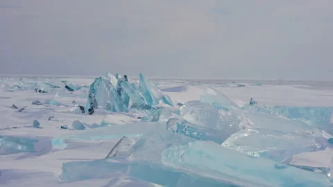 Sharp glacial ice hummocks on wide snow relief. Northern pristine scenery. Stock Footage 165146253