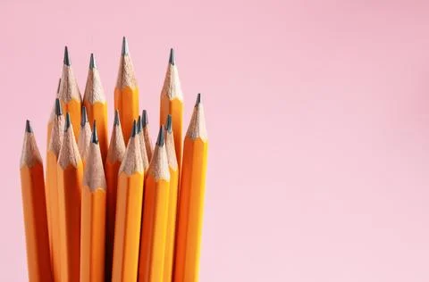 Sharp graphite pencils on pink background, closeup. Space for text 写真素材