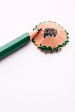 The sharp green pencil is isolated on a white background Foto stock