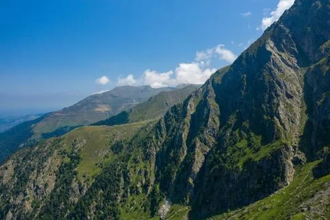 Sharp green ridges under blue sky, Pyrenees Stock Photos