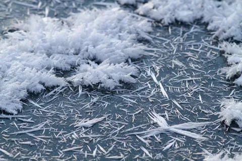 Sharp ice crystals cover the young ice Stock Photos