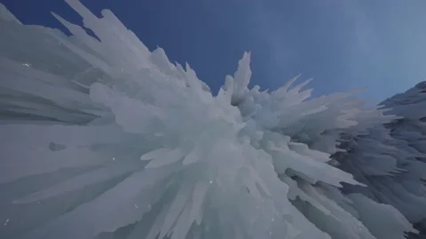 Sharp ice floes, giant icicles on cave ceiling Lake Baikal Winter frozen nature  Stock Footage 165663669