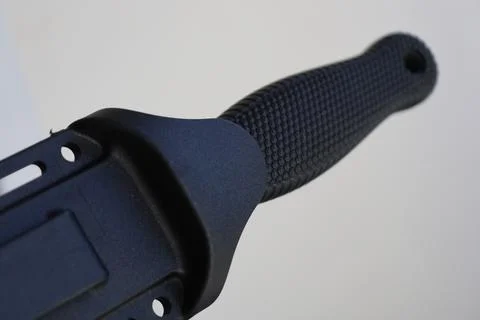 Sharp image of a knife with a black handle, ideal for editorial or commercial Stock Photos