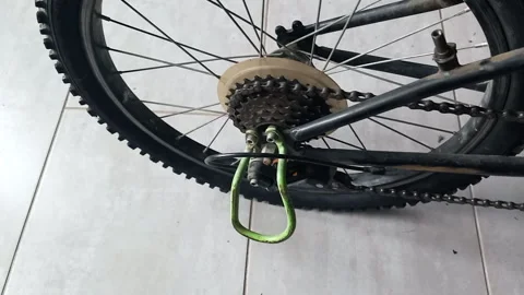 Sharp Impact Clatter of Rear Wheel Hub and Chain Slap -- Close-up on Rear Sprock Stock Footage 338176137