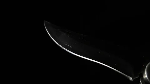 A sharp knife with a beautiful blade in his hand. Stock-Footage 122287043