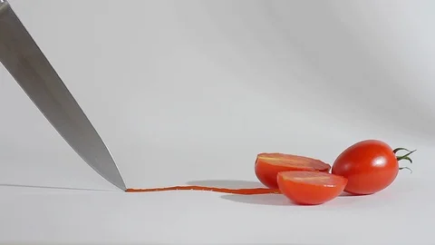A sharp knife cuts chili tomatoes_3 Video stock 118452038
