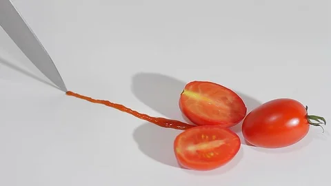 A sharp knife cuts chili tomatoes_5 Video stock 118453287