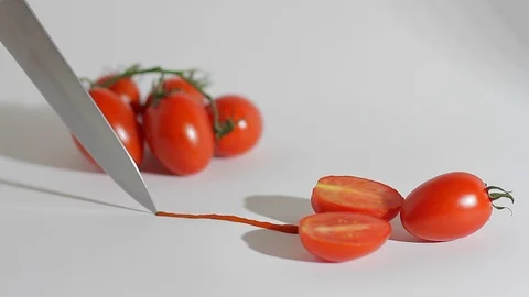 A sharp knife cuts chili tomatoes_7 Video stock 118454350