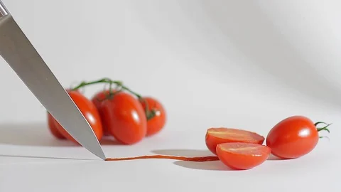 A sharp knife cuts chili tomatoes_8 Video stock 118455259