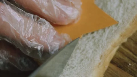 Sharp knife following a star template on sandwich bread Stock Footage 342127162