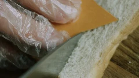 Sharp knife following a star template on sandwich bread Stock Photos
