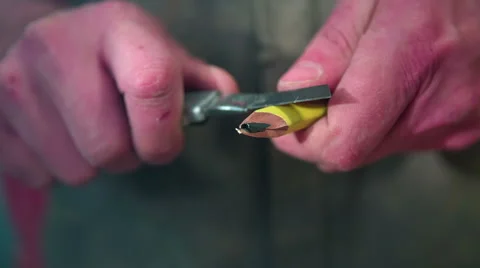 With sharp knife man sharpens the knife Stock Footage 47792860