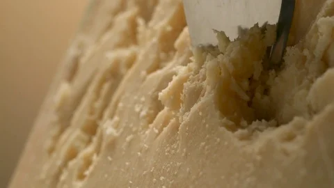 A sharp knife shreds hard cheese into small pieces. Stock Footage 83724328
