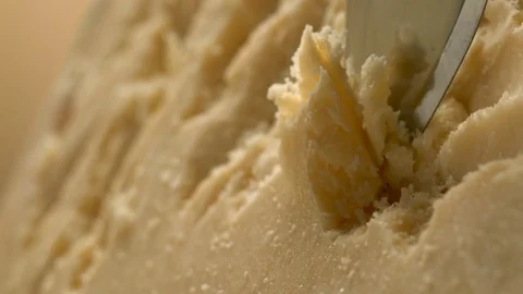 A sharp knife shreds hard cheese into small pieces. Stock Footage 83724381