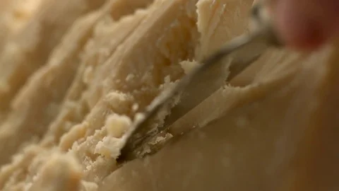 A sharp knife shreds hard cheese into small pieces. Stock Footage 83724443